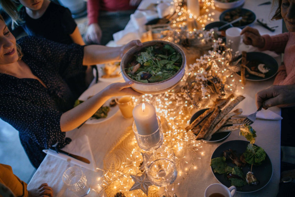 Passing food at holiday dinner.